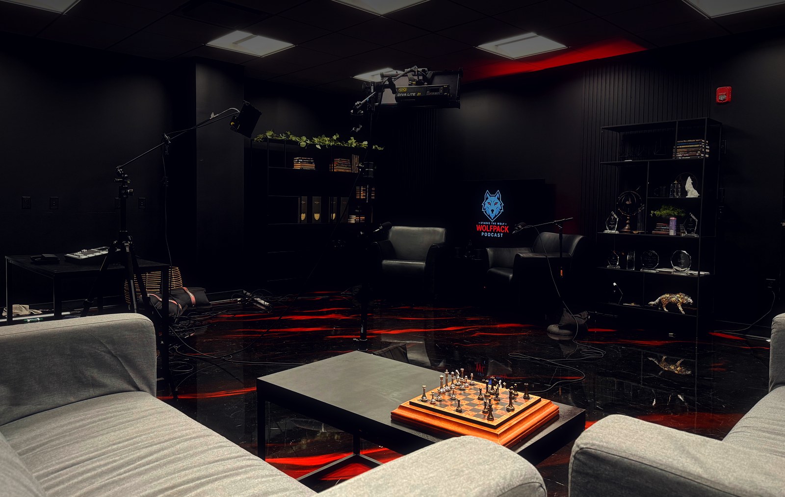 Inside The Executive Studio — podcast set, lighting rig and red epoxy floor